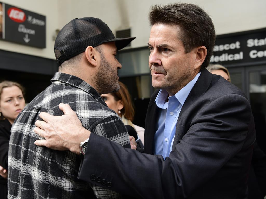 Mascot Towers apartment owner Fabiano Santos (left) with NSW Minister for Better Regulation and Innovation, Kevin Anderson. Picture: Bianca De Marchi/AAP