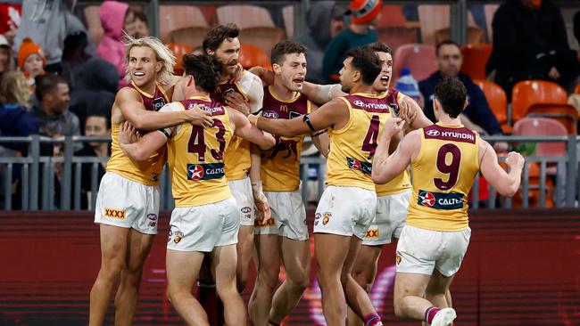 SYDNEY, AUSTRALIA - SEPTEMBER 14: Joe Daniher of the Lions celebrates a goal with teammates during the 2024 AFL First Semi Final match between the GWS GIANTS and the Brisbane Lions at ENGIE Stadium on September 14, 2024 in Sydney, Australia. (Photo by Dylan Burns/AFL Photos via Getty Images)