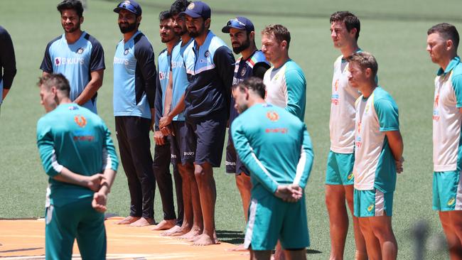 Australia and India take part in a barefoot ceremony in support of Black Lives Matter before a One-Day International match in 2020. Picture: Brett Costello