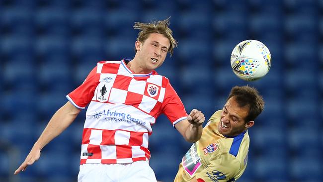 Max Brown of the Knights heads the ball during the FFA Cup round of 32 match between Gold Coast Knights and Newcastle Jets at Cbus Stadium.