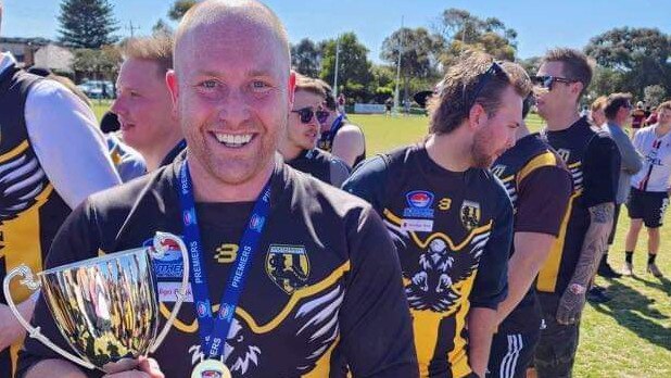 Heatherhill president and full-back Zac White with the premiership trophy.