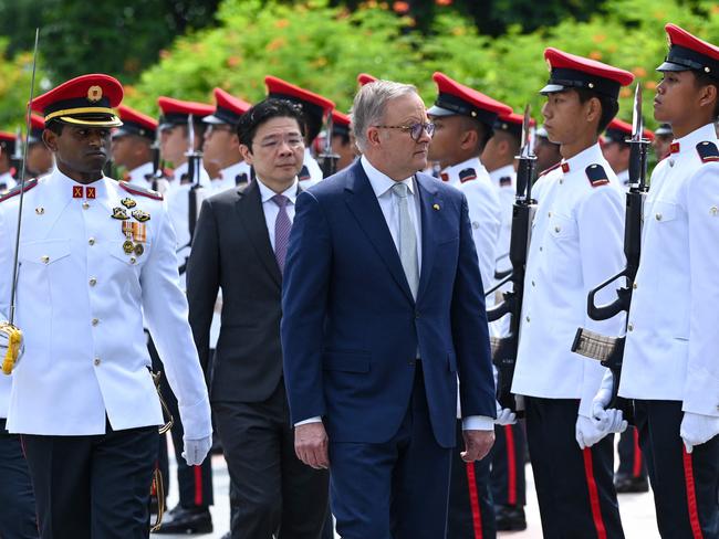 Anthony Albanese walks past a guard of honour during a welcome ceremony at Istana presidential palace in Singapore. Picture: Roslan Rahman