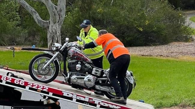 The motorbike is removed from the scene. Picture: 10 News First