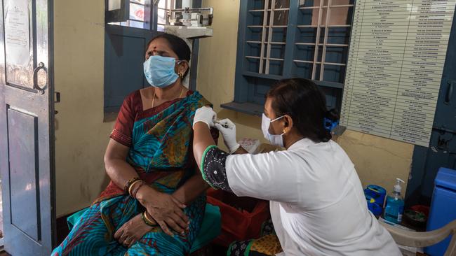 A patient receives a Covid vaccination at a public health centre in Mysuru, Karnataka, India. Some tech companies are offering injections at corporate campuses. Picture: Getty Images