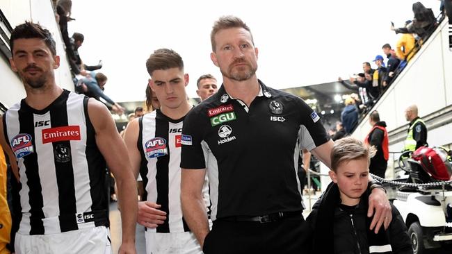 Collingwood coach Nathan Buckley leads his players off the MCG. Picture: Nicole Garmston