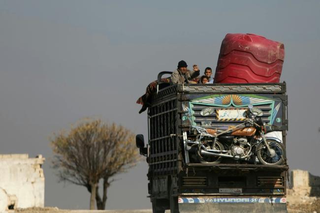 Syrians have fled the town of Suran, between Aleppo and Hama, many of them carrying whatever they could take aboard their vehicles