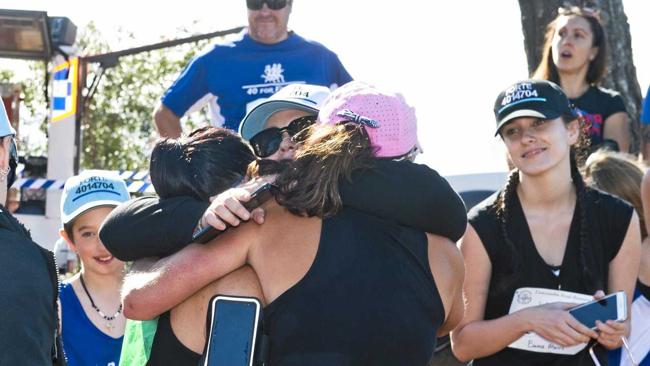 Susie Forte hugs  Katie Forte at the end of 40 for Fortey relay run. Sunday, 27th May, 2018. Picture: Nev Madsen