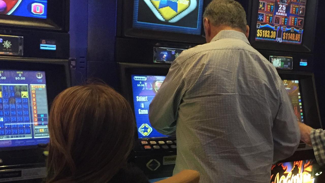 People playing poker machines. Generic image.