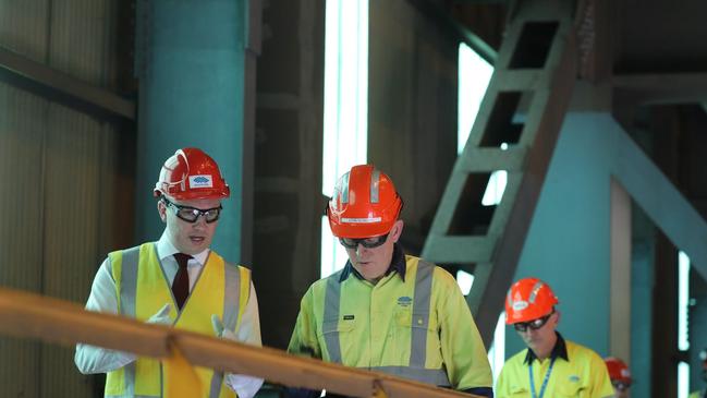 Energy and environment Minister Matt Kean (left) at Bluescope's Port Kembla site in 2020 alongside Australian steel chief executive John Nowlan (right). Picture Supplied