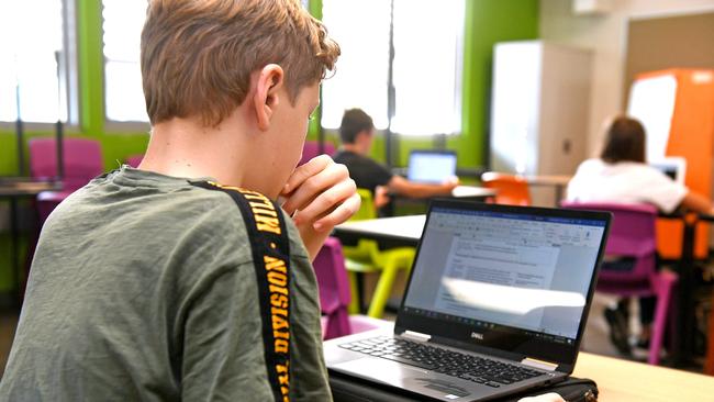 Students in their class room at Indooroopilly State High School for their first day of school on Monday. (AAP image, John Gass)