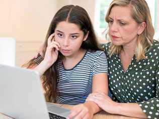 Have discussions with your children about what they are listening to and looking at online to help them establish boundaries. Picture: iStock