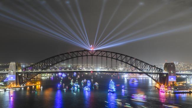 A long exposure photographs shows ships passing under the Sydney Harbour Bridge on New Year's Eve. Picture: AAP