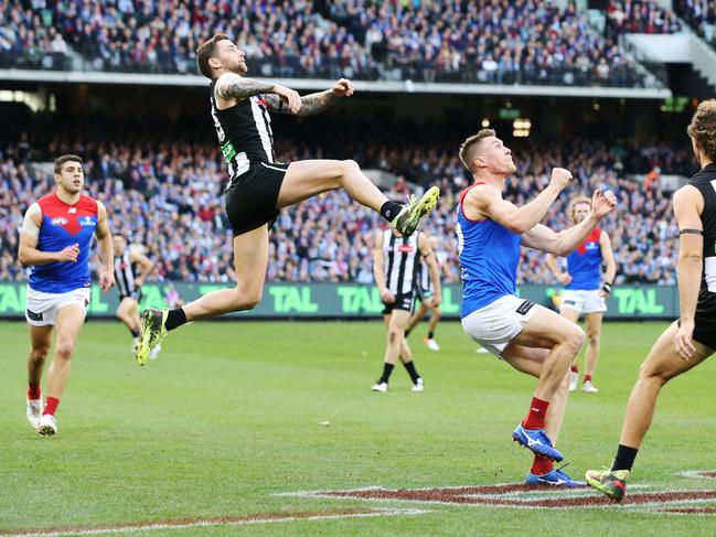 MELBOURNE, AUSTRALIA - JUNE 10: Jeremy Howe of the Magpies leaps into Tom McDonald of the Demons for an attempted mark but was penalised during the AFL Round 12 match between Collingwood v Melbourne at Melbourne Cricket Ground on June 10, 2019 in Melbourne, Australia. (Photo by Michael Dodge/AFL Photos/Getty Images)