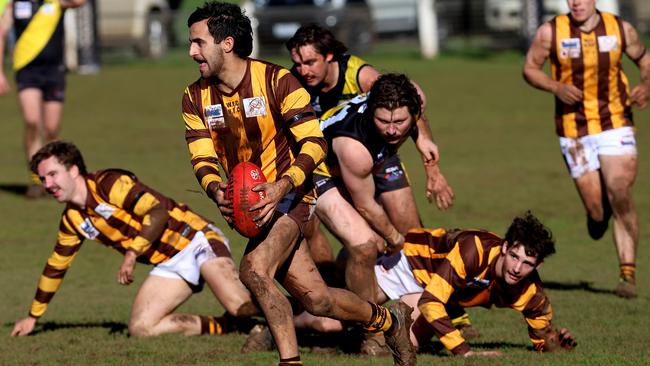 Jack Arceri with the ball for Woodend-Hesket last season. He’s joined Dromana. Photo: Hamish Blair