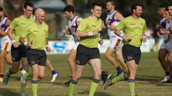 WRFL Division 1 umpires warm up before a match this season. Picture: Local Legends Photography