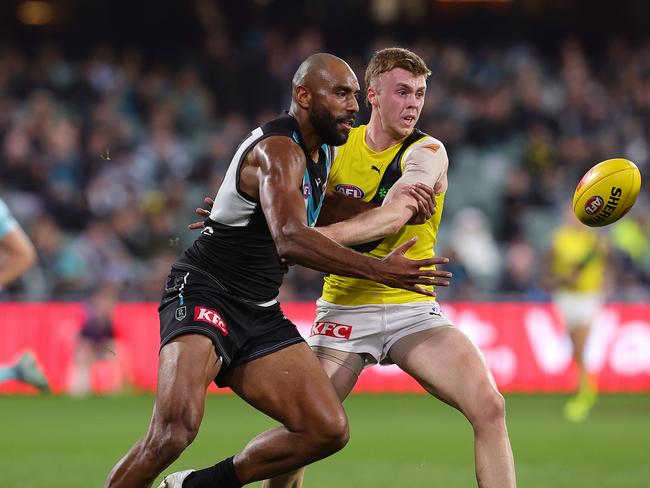 Esava Ratugolea and Tom Brown contest for the footy on Saturday. Picture: Sarah Reed/AFL Photos via Getty Images.