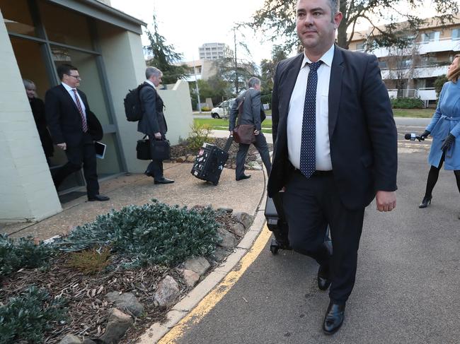 New freedom of information documents show these federal police officers were carrying guns when they raided Ms Smethurst’s home. Picture: News Corp