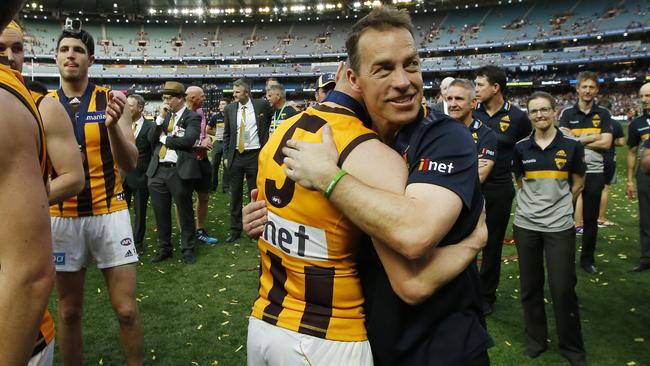 Sam Mitchell and Alastair Clarkson embrace. Picture: David Caird