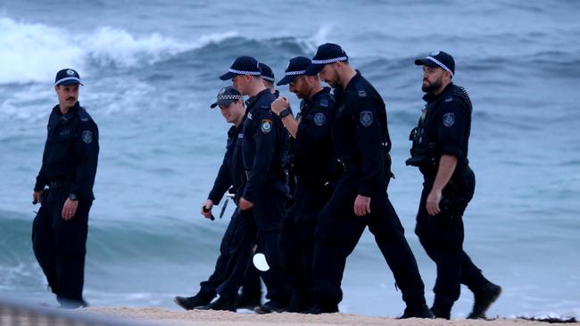 High security.....Police scan Bondi Beach ahead of the visit. Picture:  Nathan Edwards