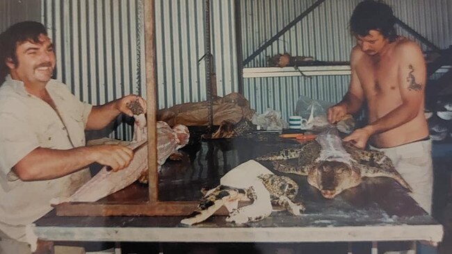 'Bunk' (full name unknown) and Roger Matthews (who went on to establish Triple C Crocodile Catching Contractors) skinning crocodiles at the Coolibah Crocodile Farm in the 1990s. Picture: Supplied