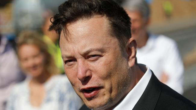 (FILES) In this file photo taken on September 3, 2020 Tesla CEO Elon Musk talks to media as he arrives to visit the construction site of the future US electric car giant Tesla, in Gruenheide near Berlin. - The court battle between Elon Musk and Twitter kicked off on July 19, 2022, as the social media firm tries to force the entrepreneur to honor their $44 billion buyout deal. The first hearing will center on Twitter's push to set a trial date for as early as September in a case that has massive stakes for both parties. (Photo by Odd ANDERSEN / AFP)