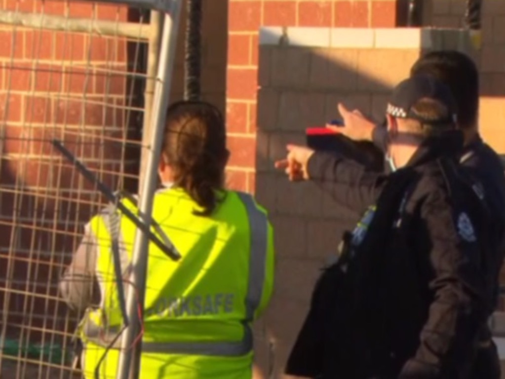 Police and WorksSafe officers remain at the site. Picture: 7 News