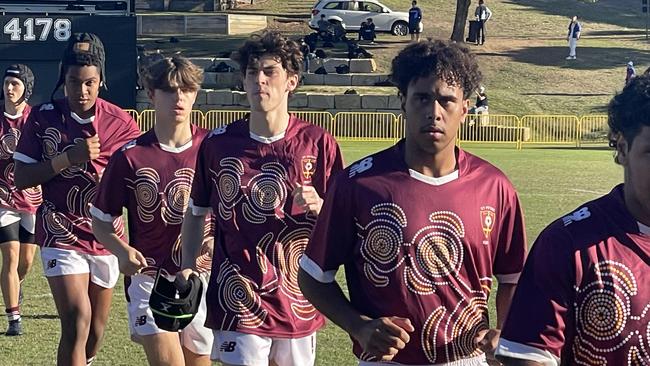 St Peters take to the field in their indigenous jumpers.