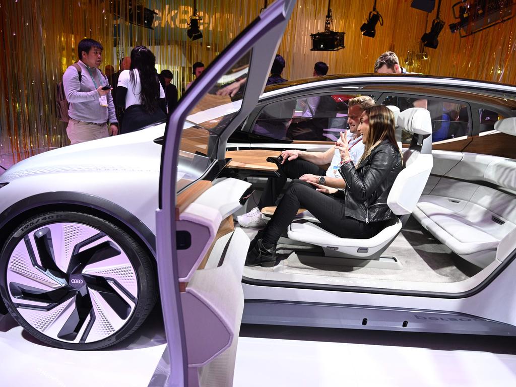 An attendee sits in the Audi Q4 e-tron urban mobility autonomous conceptcar with a retractable desk at the drivers' seat at the 2020 Consumer Electronics Show (CES) in Las Vegas, Nevada. Picture: Robyn Beck