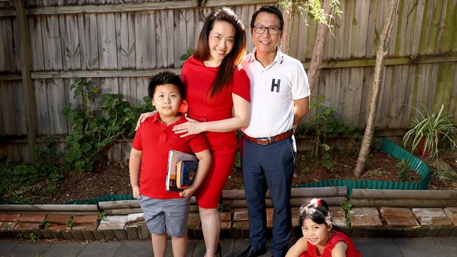 Dad Harry Tran with his son Bach, 10, and daughter Isabella, 6, said he wants his kids to return to Rosehill Public School as soon as possible. Picture: Toby Zerna