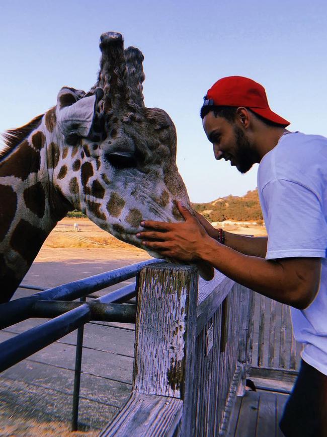 Aussie basketballer Ben Simmons locked eyes with the tallest animal in the world. Picture: Instagram/@bensimmons