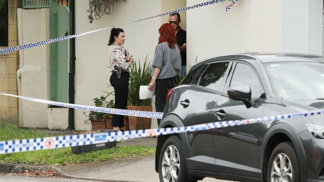 Police talking to neighbours on Ferris Street Annandale. Picture: Richard Dobson