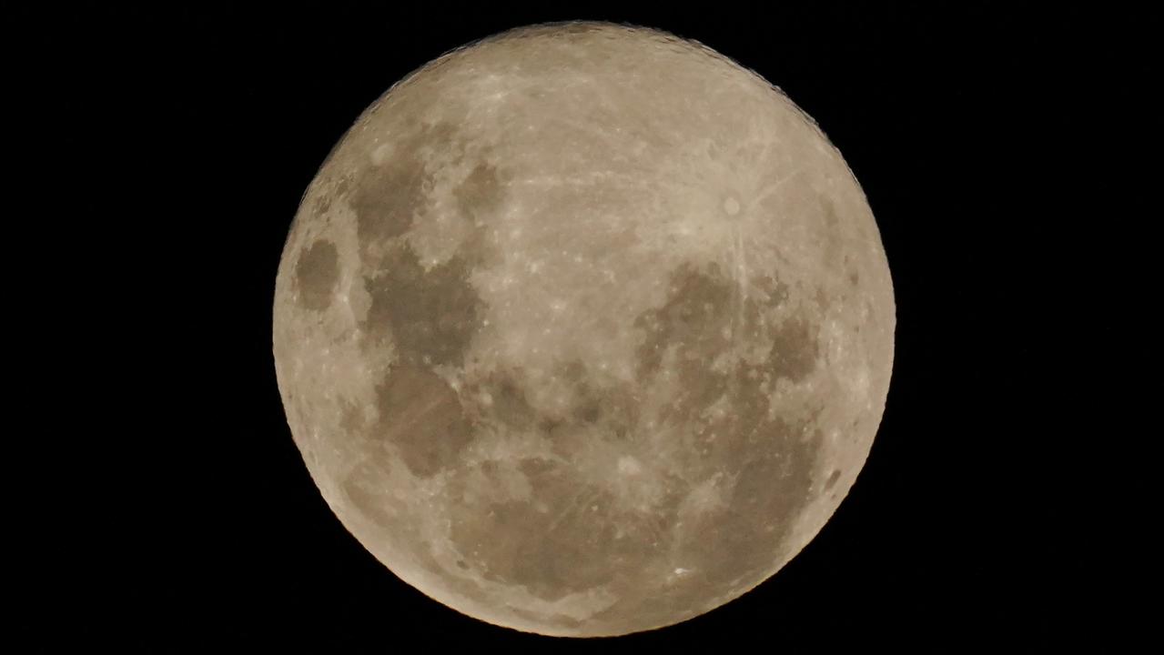 The ‘pink’ supermoon in Melbourne last year. Picture: AAP Image/Michael Dodge