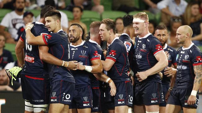 Rebels players celebrate their drought-breaking win over the Highlanders. Picture: AAP