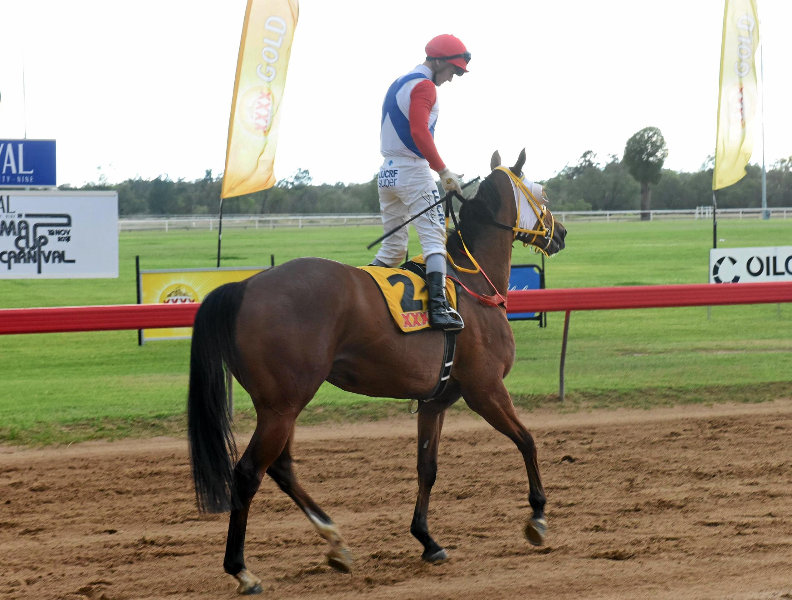 Jockey Anthony Allen celebrating his 2017 Roma Cup win on Gully Command. Picture: Alexia Austin