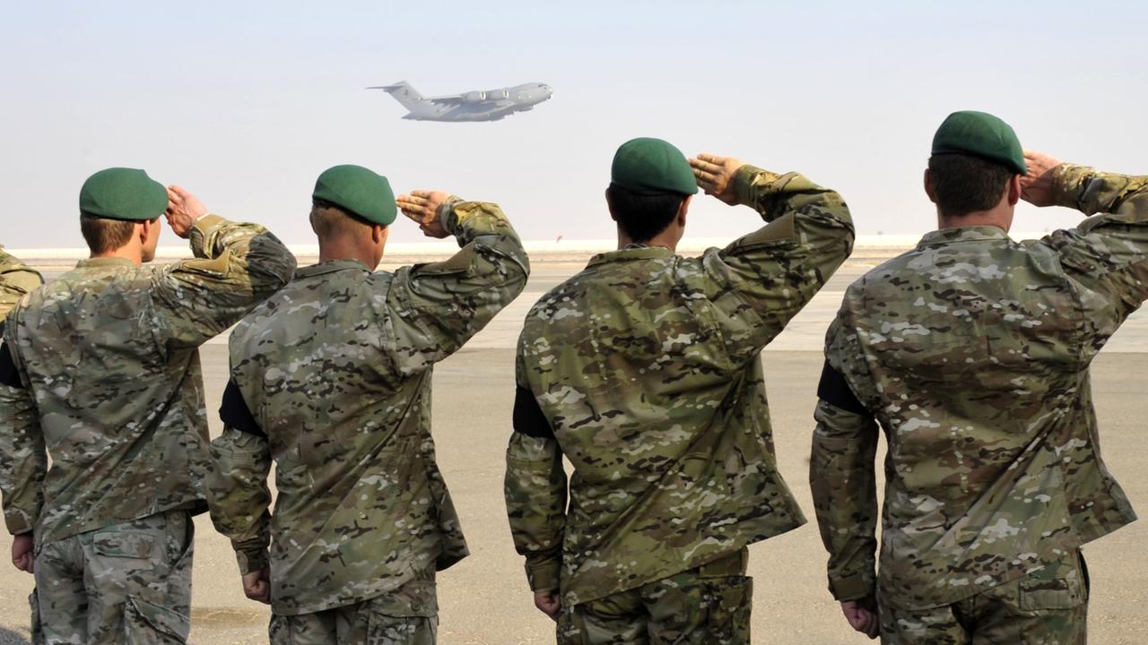 Special Operations Task Group soldiers salute fallen Corporal Scott Smith. Picture: Department of Defence