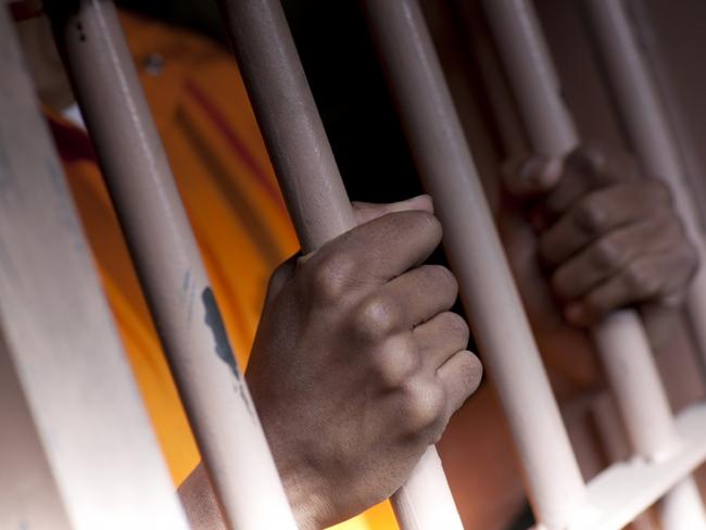 02/08/2011 FEATURES: Generic, prisoner, prison, hands, jail, man. SHS Books.