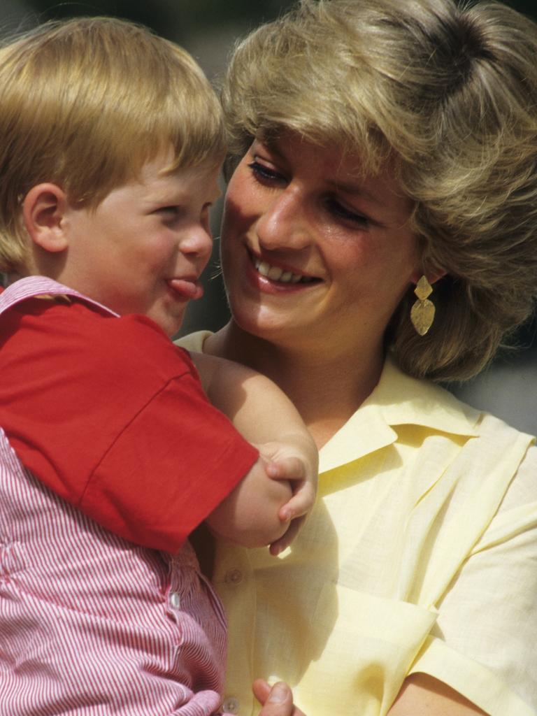 Diana with Prince Harry on holiday in Spain on August 10, 1987. Picture: Georges De Keerle/Getty Images