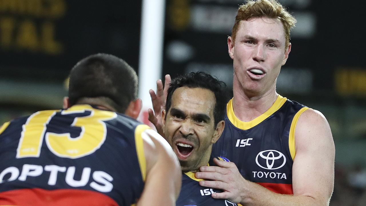 Eddie Betts celebrates another incredible goal from the boundary with co-captain Taylor Walker and Tom Lynch. Picture SARAH REED