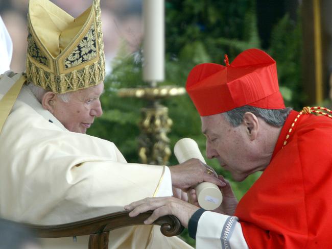 2003: Newly-appointed cardinal George Pell kisses Pope John Paul II's hand on St Peter Square at the Vatican. Picture: AFP/Paolo Cocco