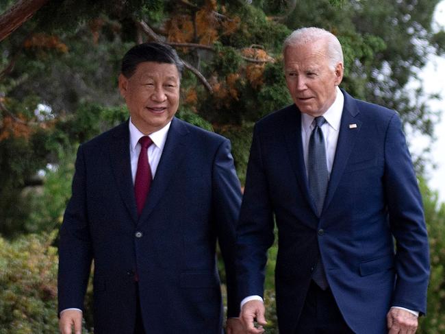 President Joe Biden and Chinese President Xi Jinping walk together after a meeting during the Asia-Pacific Economic Cooperation Leaders' week in Woodside, California. Picture: Brendan Smialowski / AFP)