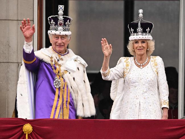 King Charles III and Queen Camilla wave from the Buckingham Palace balcony after their coronation. Picture: AFP