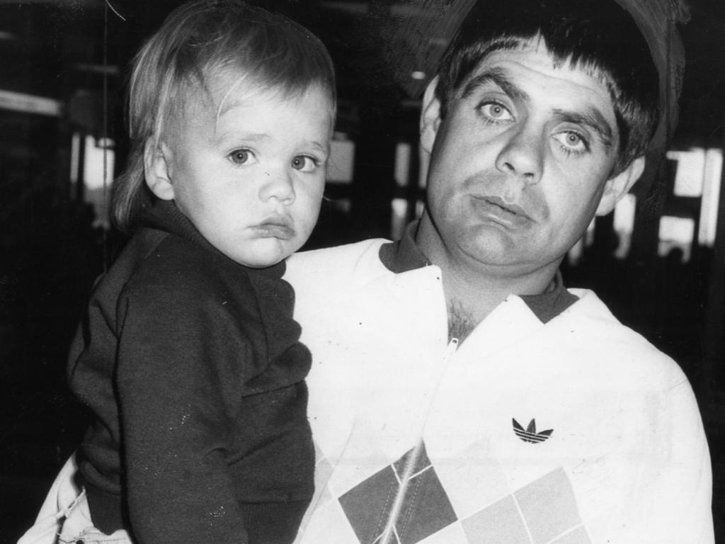 Footballer Robert Muir with his son Matthew, 2, back in Adelaide after being suspended for 12 matches by the VFL tribunal 08 May 1984.