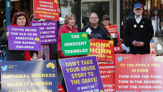 Care Leavers Australian Network doing a silent protest outside the office to press for a national redress scheme for the victims of child sex abuse. Picture: ELENOR TEDENBORG