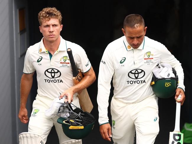 Nathan McSweeney walks out to bat with Usman Khawaja. Picture: Chris Hyde/Getty Images