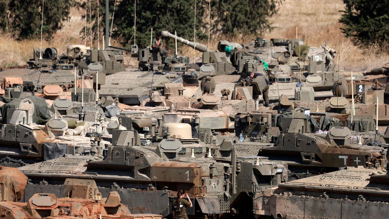 Israeli army tanks and armoured vehicles are deployed in the Upper Galilee region of northern Israel near the border with Lebanon. Picture: Menahem KAHANA / AFP