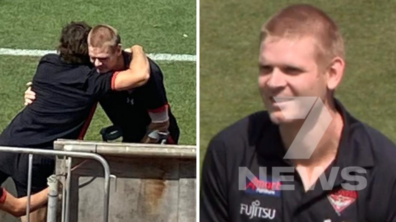 Michael Hurley greeted Essendon teammates after being hospitalised this month with a hip infection.
