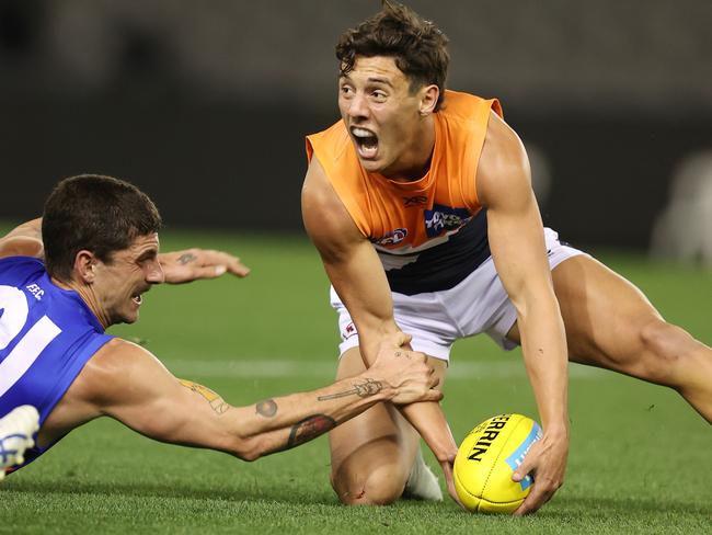 AFL Round 3. Western Bulldogs v Greater Western Sydney at Marvel Stadium. 19/06/2020.   Jye Caldwell of the Giants at ground level battling with Tom Liberatore of the Bulldogs   . Pic: Michael Klein