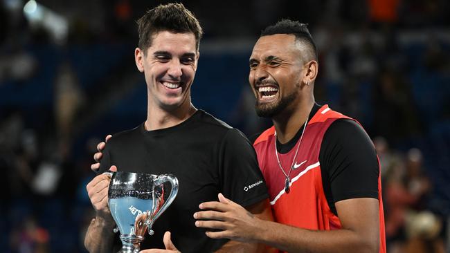 Thanasi Kokkinakis (L) of Australia and Nick Kyrgios of Australia pose with the championship trophy after winning their Men's Doubles Final at the 2022 Australian Open. Picture: Quinn Rooney/Getty Images