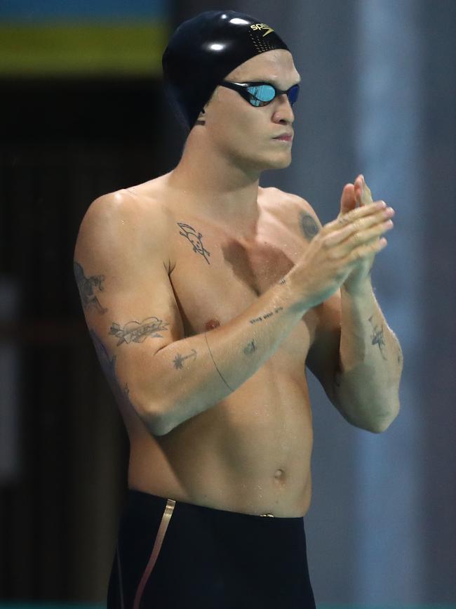 The pop star/swimmer psyches himself up before the race.