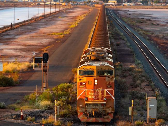 A BHP freight train carrying Australian iron ore to port. Australia ships around a third of its overall exports to China. PHOTO: IAN WALDIE/BLOOMBERG NEWS